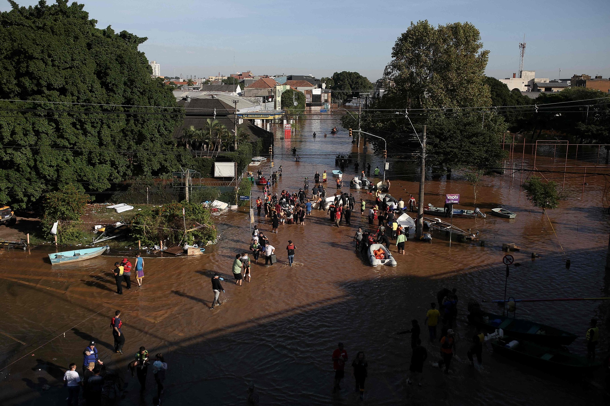 An aerial view shows volunteers and first responders working on rescue operations at a flooded area in the Sao Joao neighborhood of Porto Alegre, Rio Grande do Sul state, Brazil, on May 7, 2024. /CFP
