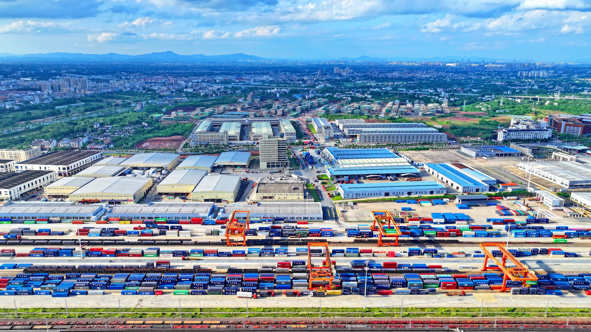 Bustling activity unfolds at Ganzhou International Land Port as cranes load and unload shipping containers for import and export on May 5, 2024, in Nankang District, Ganzhou City, Jiangxi Province, China./ CFP