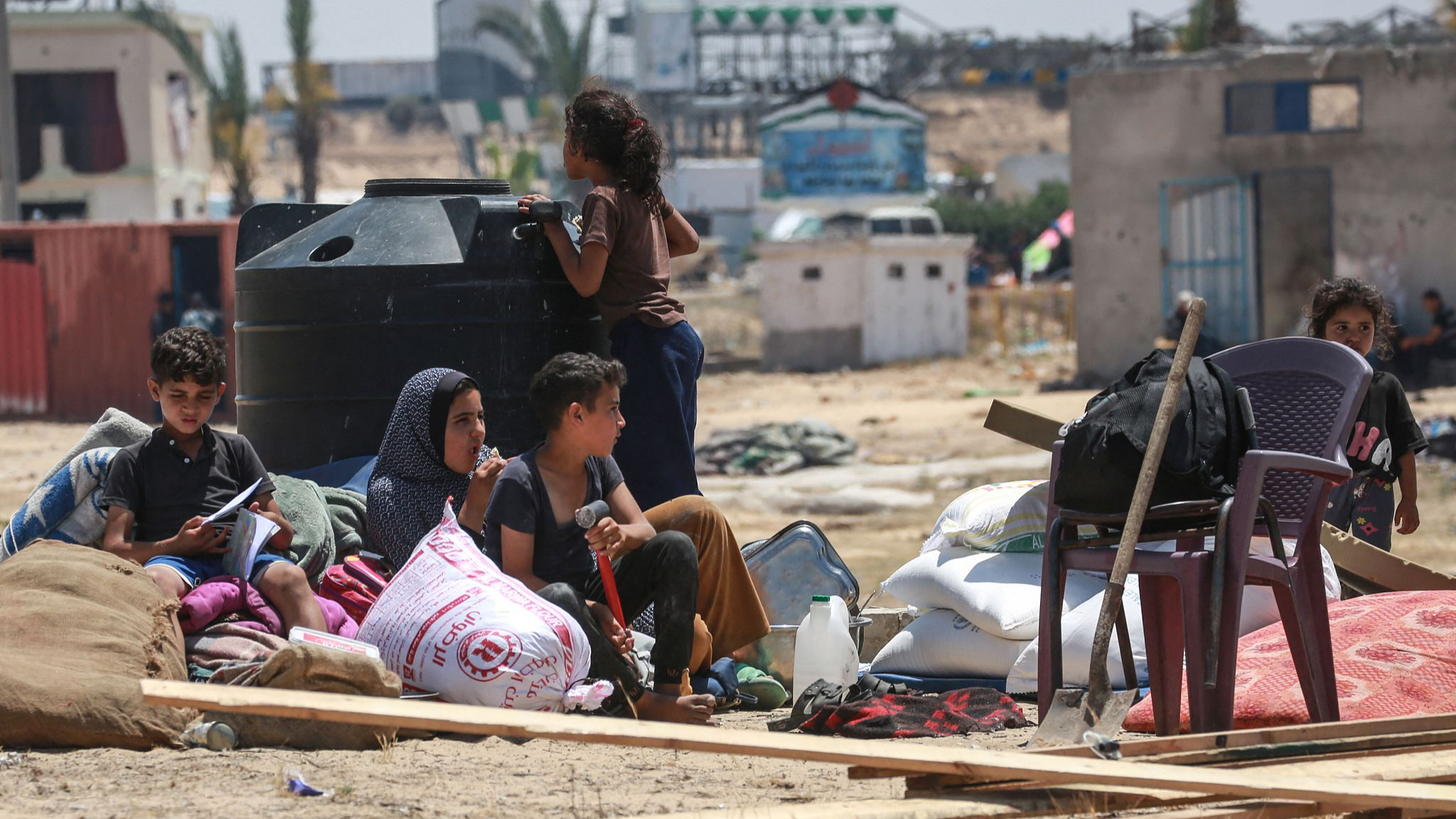 Displaced Palestinians rest as they set up their tent after returning to Khan Yunis in the southern Gaza Strip on May 9, 2024, amid the ongoing conflict between Israel and the Palestinian militant group Hamas. /CFP
