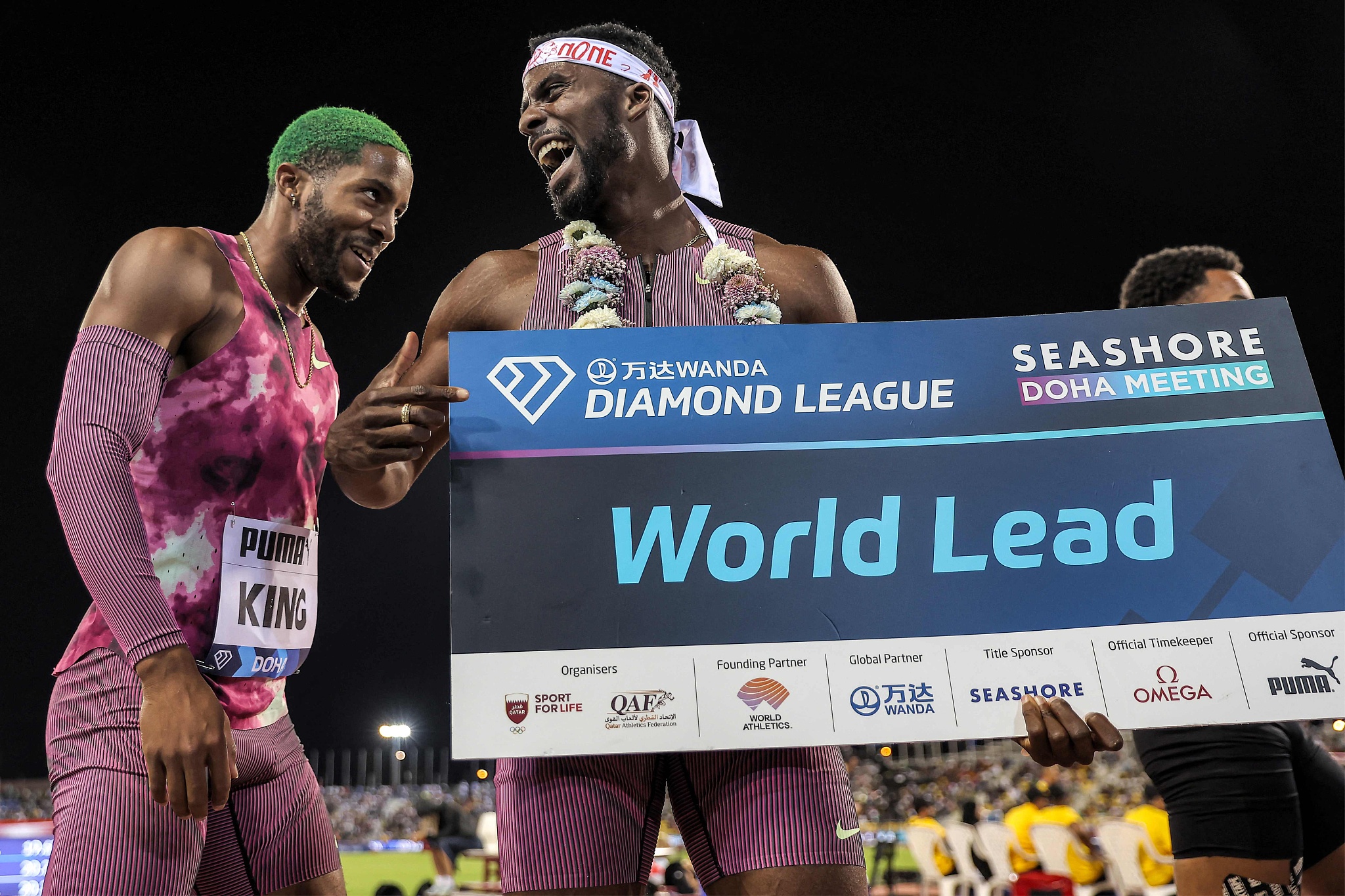 Kenneth Bednarek of the U.S. (C) celebrates with compatriot Kyree King after winning men's 200m during the Diamond League competition in Doha, Qatar, May 10, 2024. /CFP