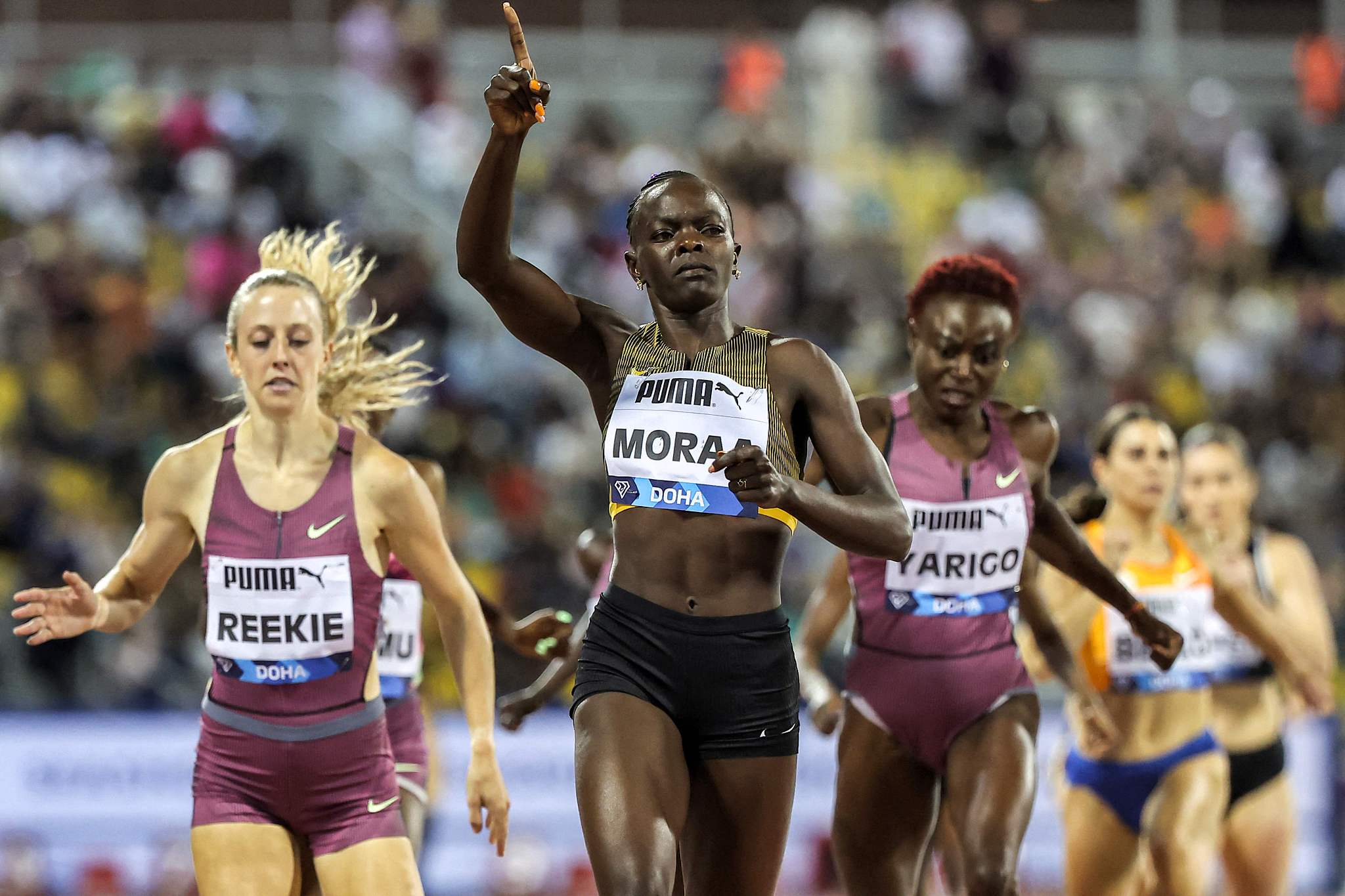 Kenya's Mary Moraa (C) gestures as she crosses the finish line in the women's 800m final during the Diamond League competition in Doha, Qatar, May 10, 2024. /CFP