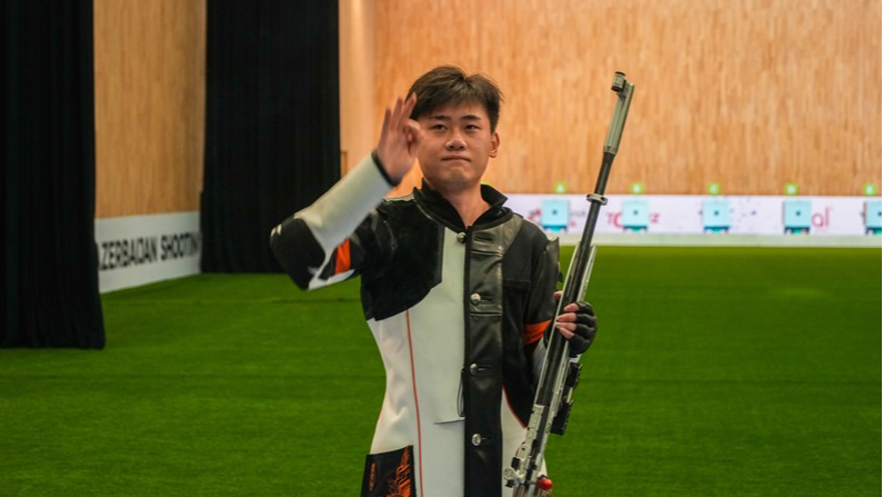 Liu Yukun celebrates after winning the men's 50m rifle 3 positions final at the ISSF World Cup in Baku, Azerbaijan, May 11, 2024. /Xinhua