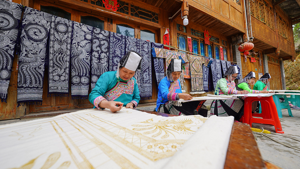 Women of the Miao ethnic group are busy working on Miao batik products to meet market demand in Rongjiang County, Guizhou Province, April 24, 2024. /CFP