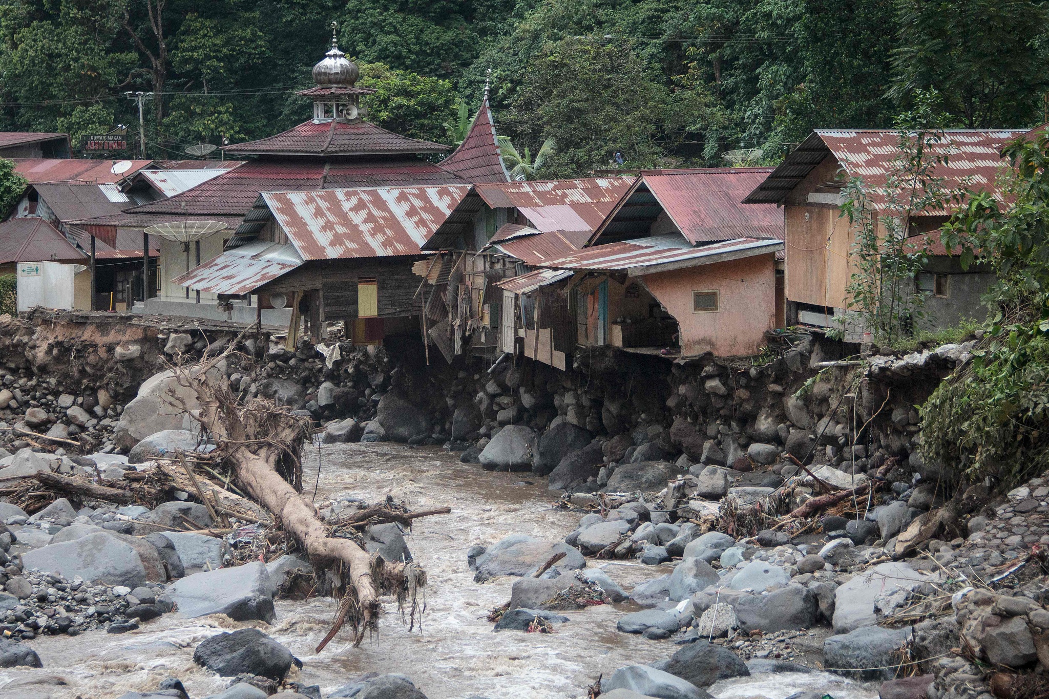 Damaged houses are seen after flash floods and cold lava flow from a volcano in Tanah Datar, West Sumatra, May 12, 2024. /CFP