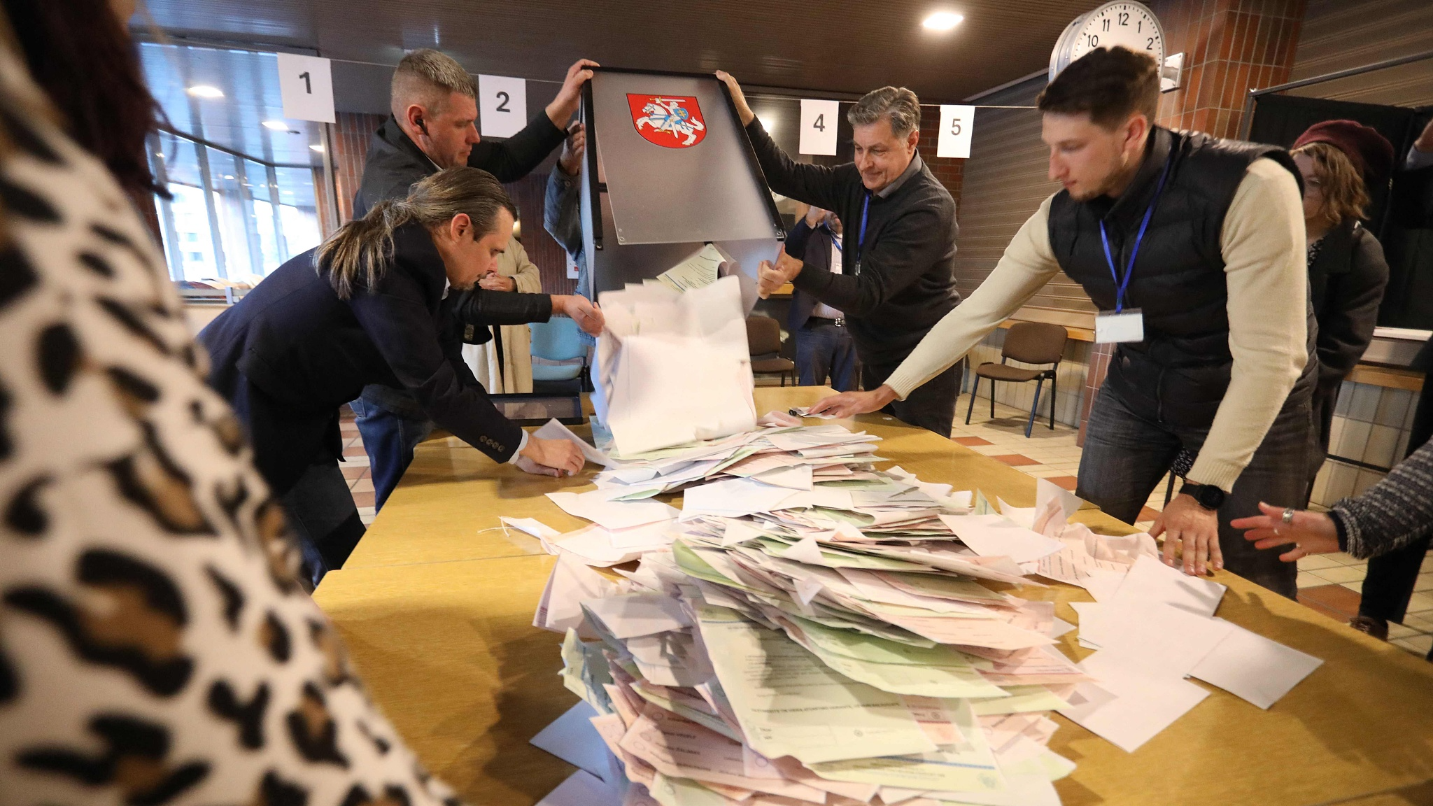 Members of a local electoral commission count ballots at a polling station during the first round of Lithuania's presidential election at a polling station in Vilnius, Lithuania, May 12, 2024. /CFP