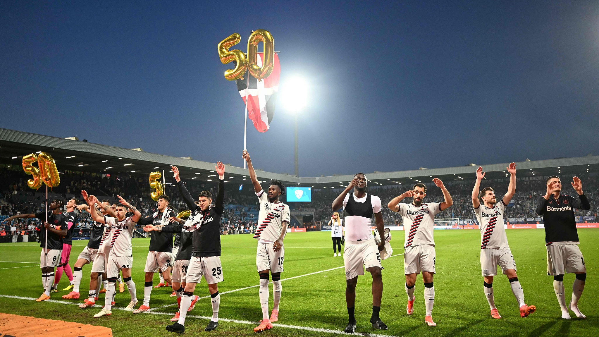 Leverkusen players celebrate their 50-game unbeaten streak in a single season in Bochum, Germany, May 12, 2024. /CFP