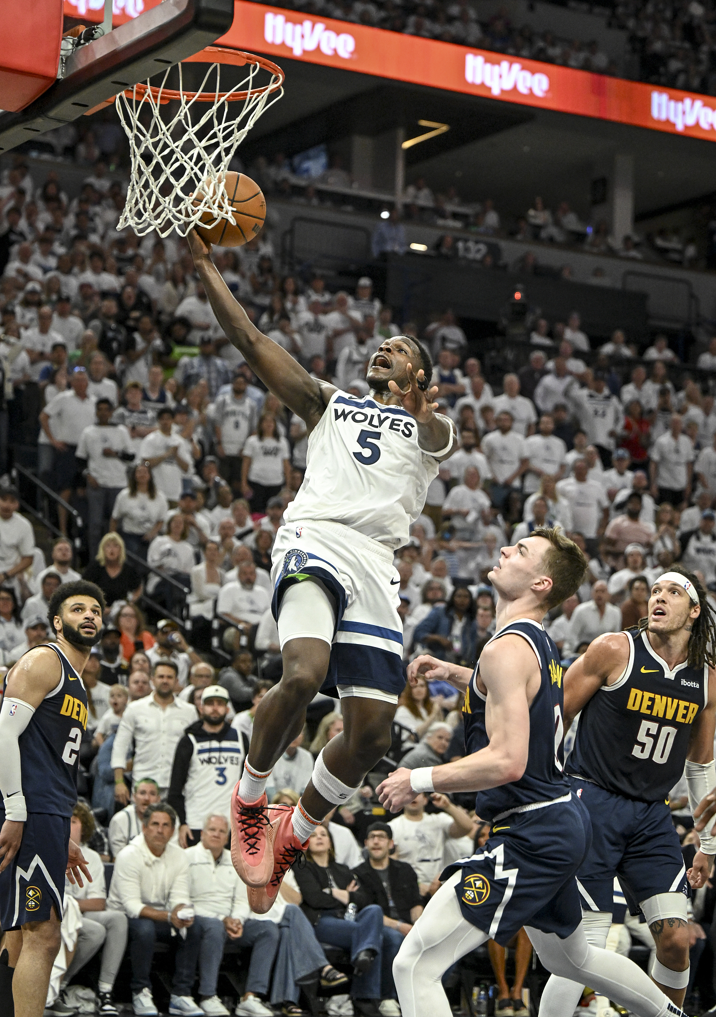 Anthony Edwards (#5) of the Minnesota Timberwolves scores as Christian Braun (C) of the Denver Nuggets looks up during the third quarter of their game at Target Center in Minneapolis, U.S., May 12, 2024. /CFP