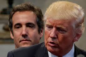 Donald Trump's then-personal attorney, Michael Cohen, stands behind Trump as he runs for president during a campaign stop at the New Spirit Revival Center church in Cleveland Heights, Ohio, U.S., September 21, 2016. /Reuters