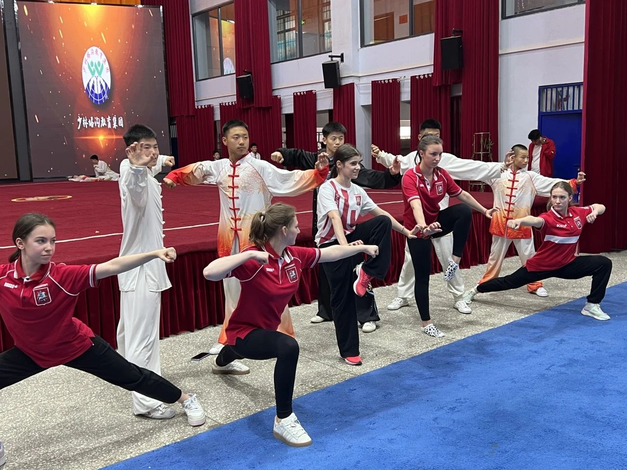 Young martial arts practitioners from Russia pair skills with students from the Tagou Martial Arts School in central China’s Henan Province. /Photo provided to CGTN