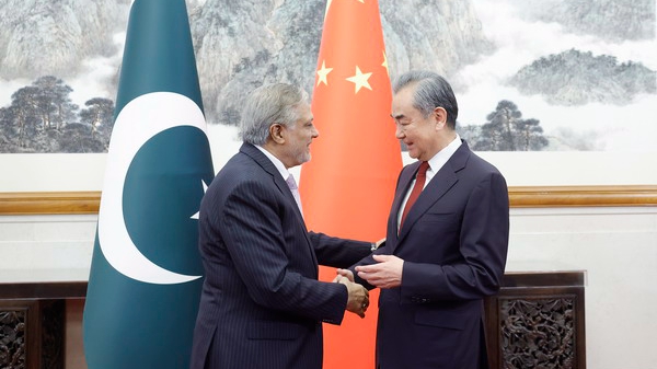Chinese Foreign Minister Wang Yi (R) shakes hands with Pakistan's Deputy Prime Minister and Foreign Minister Mohammad Ishaq Dar in Beijing, China, May 15, 2024. /Chinese Foreign Ministry