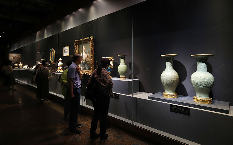People visit the joint exhibition showcasing exchanges between China and France in the 17th and 18th centuries, in Beijing, May 14, 2024. /CFP
