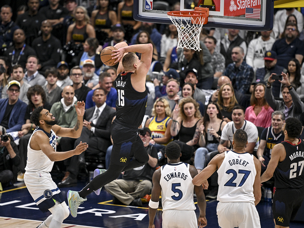 Nikola Jokic (#15) of the Denver Nuggets dunks in Game 5 of the NBA Western Conference semifinals against the Minnesota Timberwolves at Ball Arena in Denver, Colorado, May 14, 2024. /CFP