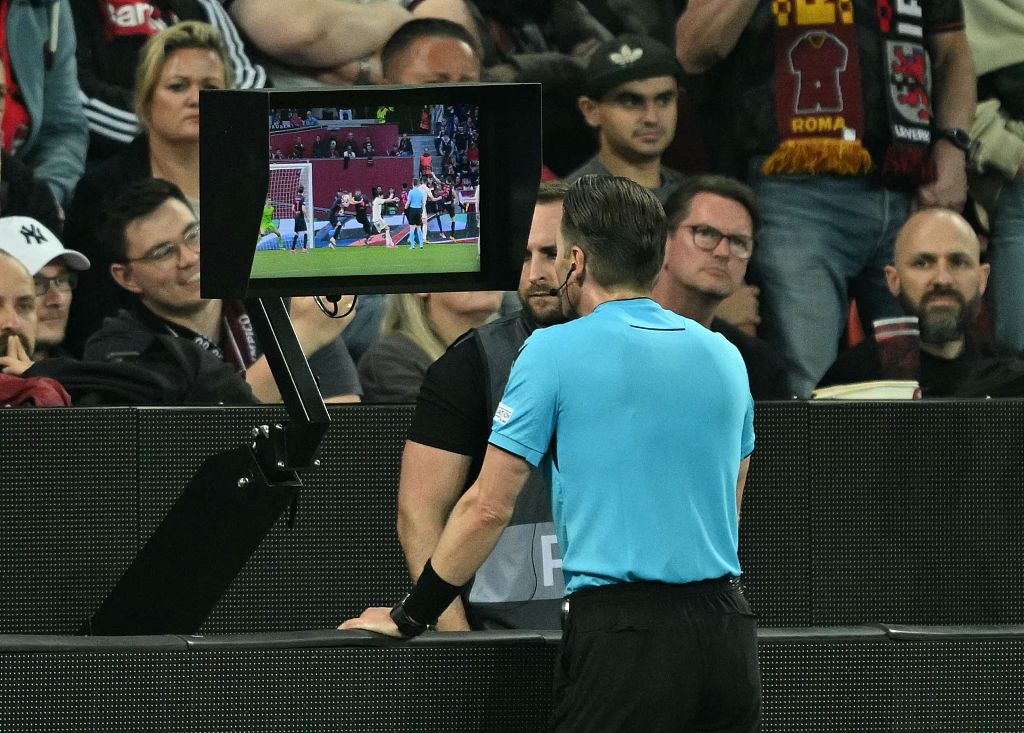A referee checking the replay during the UEFA Europa League game between Byaer 04 Leverkusen and AS Roma at BayArena in Leverkusen, Germany, May 9, 2024. /CFP 