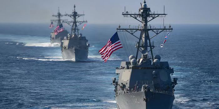 The Arleigh Burke-class guided-missile destroyers USS Preble (DDG 88), USS Halsey (DDG 97) and USS Sampson (DDG 102) are underway behind the aircraft carrier USS Theodore Roosevelt (CVN 71). /U.S. Navy