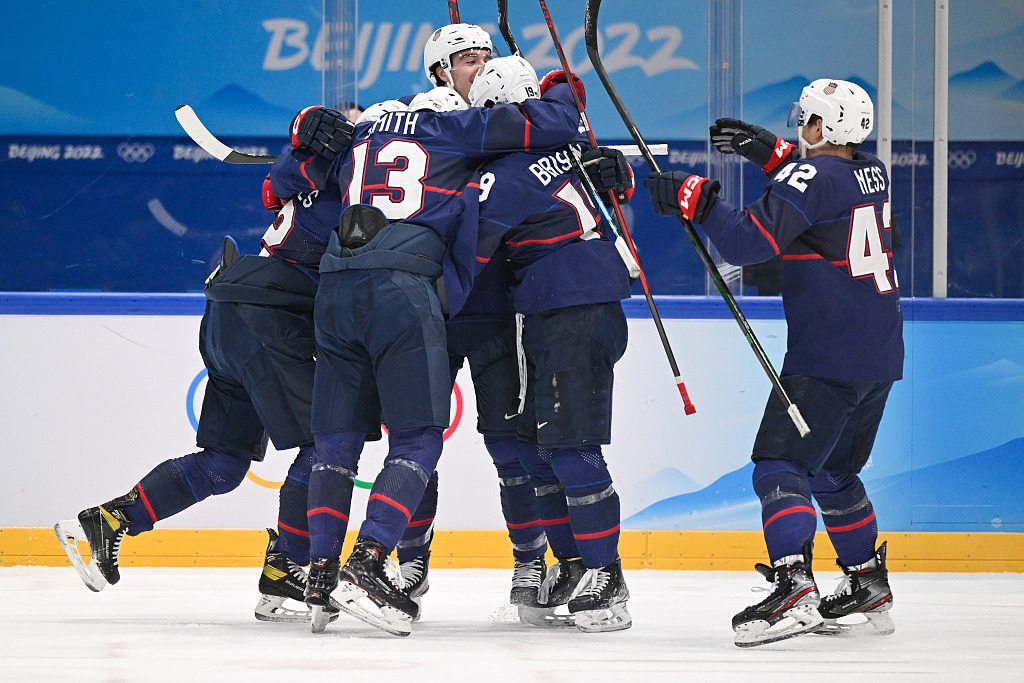 Players of Team USA celebrate after scoring a goal in the ice hockey men's quarterfinals against Slovakia at the Winter Olympic Games at the National Indoor Stadium in Beijing, February 16, 2022. /CFP