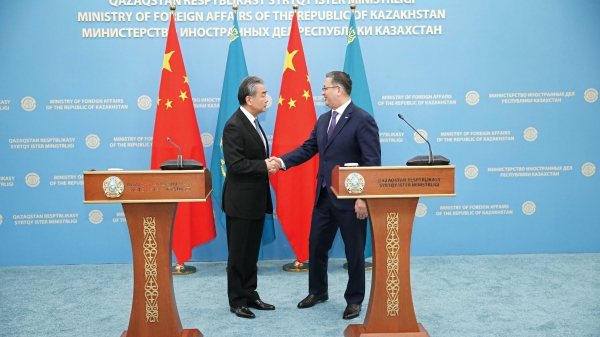 Chinese Foreign Minister Wang Yi (L) shakes hands with Kazakh Deputy Prime Minister and Foreign Minister Murat Nurtleu in Astana, Kazakhstan, May 20, 2024. /Chinese Foreign Ministry