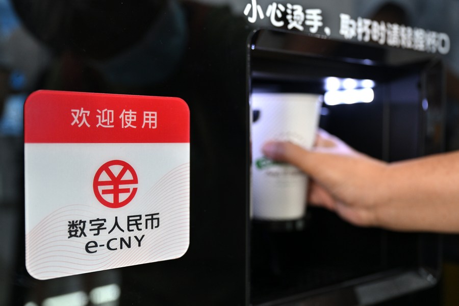 A visitor buys a cup of coffee with e-CNY (digital yuan) at an exhibition of financial services during the 2022 China International Fair for Trade in Services (CIFTIS) at the Shougang Park in Beijing, capital of China, September 4, 2022. /Xinhua