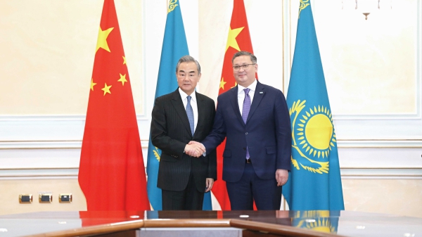 Chinese Foreign Minister Wang Yi (L) meets with Kazakh Deputy Prime Minister and Minister of Foreign Affairs Murat Nurtleu in Astana, Kazakhstan, May 20, 2024. /Chinese Foreign Ministry