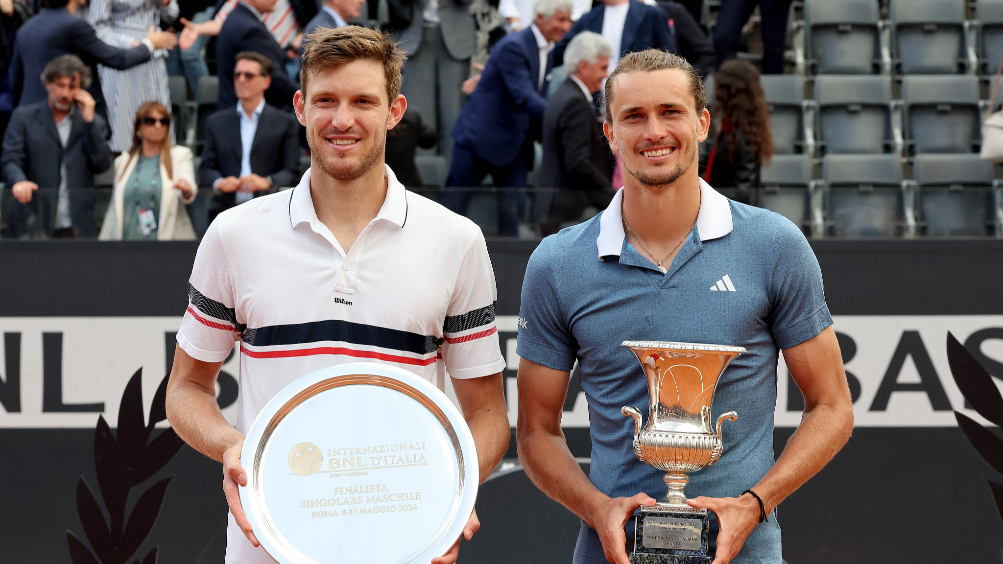 Nicolas Jarry (L) and Alexander Zverev pose with their trophies at the Italian Open award ceremony in Rome, Italy, May 19, 2024. /CFP