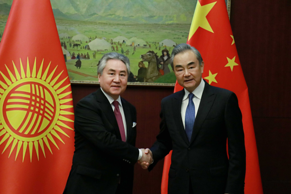Chinese Foreign Minister Wang Yi shakes hands with his Kyrgyz counterpart Jeenbek Kulubaev on the sidelines of the meeting of the Shanghai Cooperation Organization Council of Ministers of Foreign Affairs in Astana, capital of Kazakhstan, May 20, 2024. /Chinese Foreign Ministry