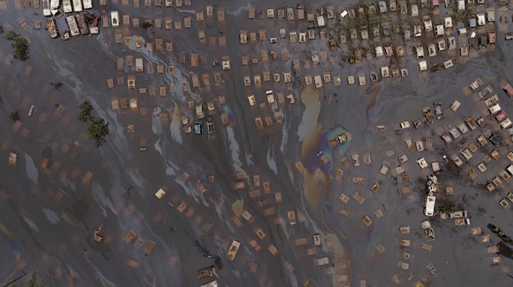 A drone view shows cars submerged in water at a courtyard of the State Traffic Department, amid flooding in Porto Alegre, Rio Grande do Sul state, Brazil, May 19, 2024. /Reuters