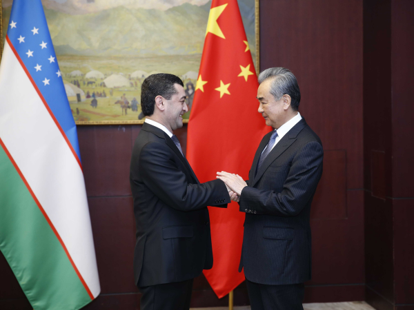 Chinese Foreign Minister Wang Yi (R) shakes hands with Uzbek Foreign Minister Bakhtiyor Saidov on the sidelines of a meeting of the Shanghai Cooperation Organization Council of Ministers of Foreign Affairs in Astana, capital of Kazakhstan, May 20, 2024. /Chinese Foreign Ministry