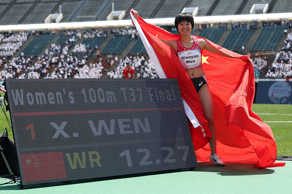 China's Wen Xiaoyan sets a new world record in the women's 100m T37 final during the Para Athletics World Championships in Kobe, Japan, May 21, 2024. /CFP