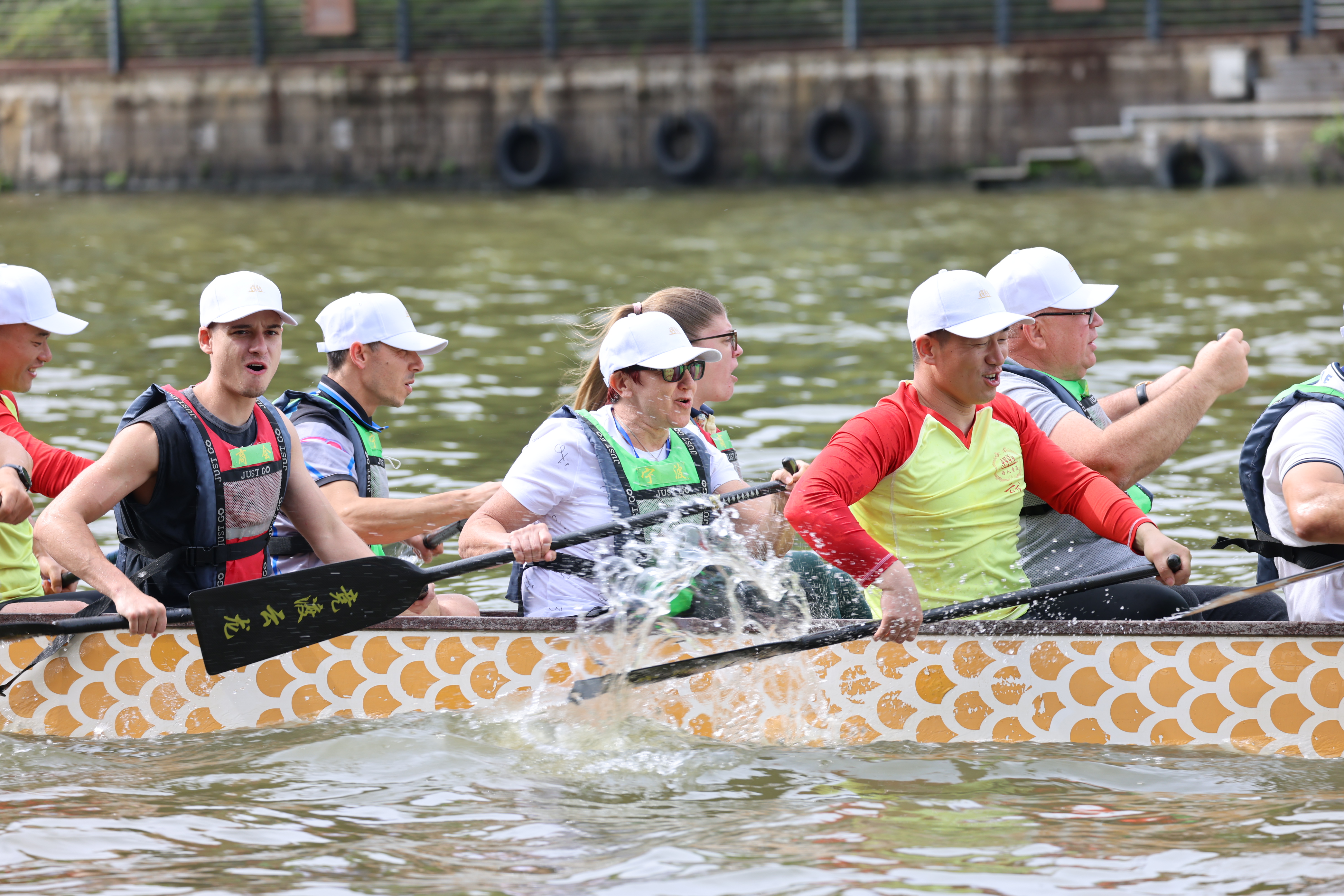 Bulgarian paddlers take part in a friendly dragon boat race in Yunlong town, Ningbo City, Zhejiang Province on May 19, 2024. [Photo provided to CGTN]
