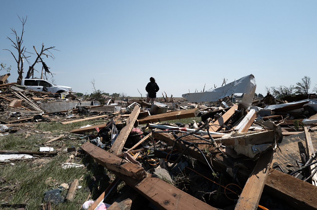 Residents go through the damage in the aftermath of a tornado in Greenfield, Iowa, U.S. May 22, 2024. /CFP