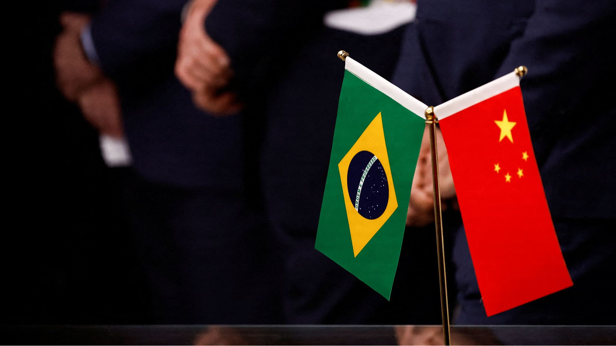 National flags of Brazil (L) and China are seen during a press conference at the Embassy of Brazil in Beijing on April 14, 2023. /CFP