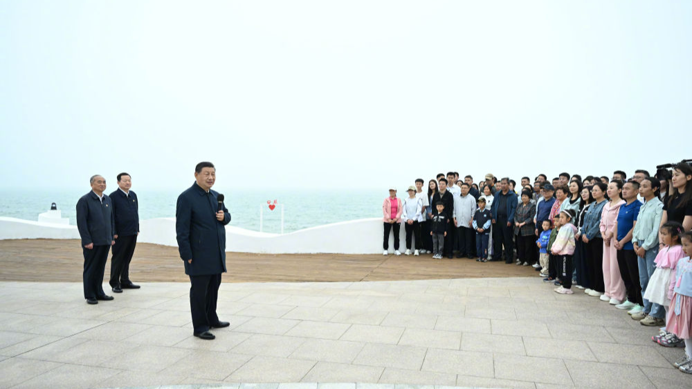 Xi Jinping, general secretary of the Communist Party of China Central Committee, speaks to people during an inspection to the city of Rizhao in east China's Shandong Province, May 22, 2024. /Xinhua