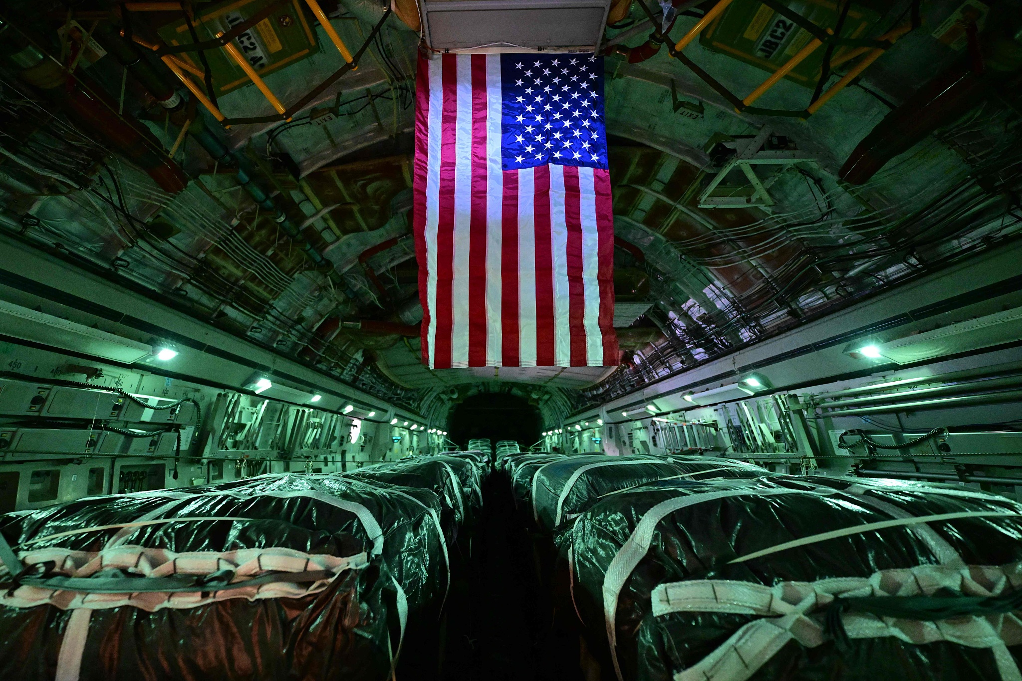 A picture taken on March 21, 2024, from onboard a U.S. military transport aircraft shows humanitarian aid parcels intended for the Gaza Strip loaded onto the aircraft ahead of departure from the Al-Udeid air base southwest of Doha. /CFP