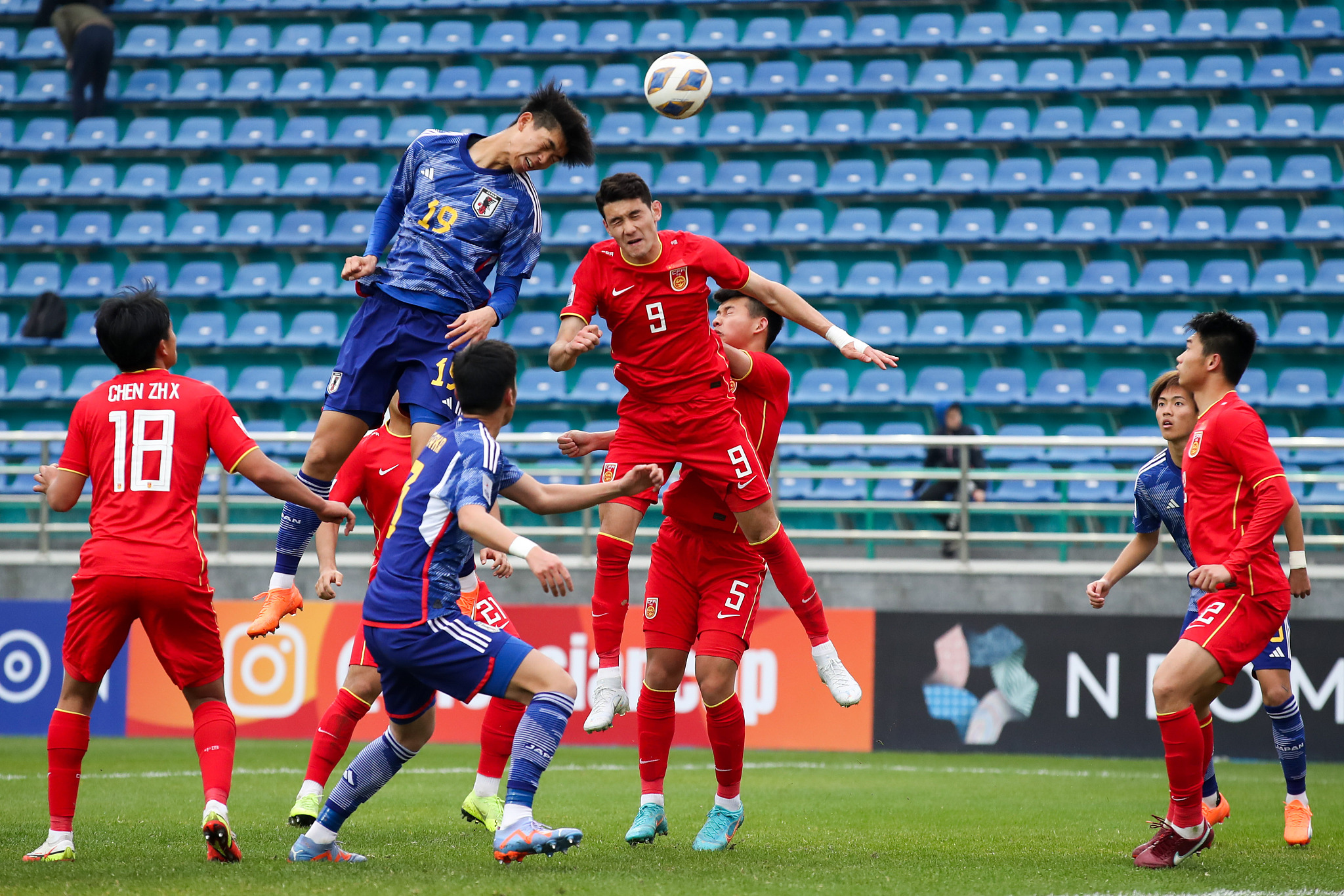 Players of China (red) and Japan battle for the ball during the AFC U20 men's Asian Cup in Tashkent, Uzbekistan, March 3, 2023. /CFP