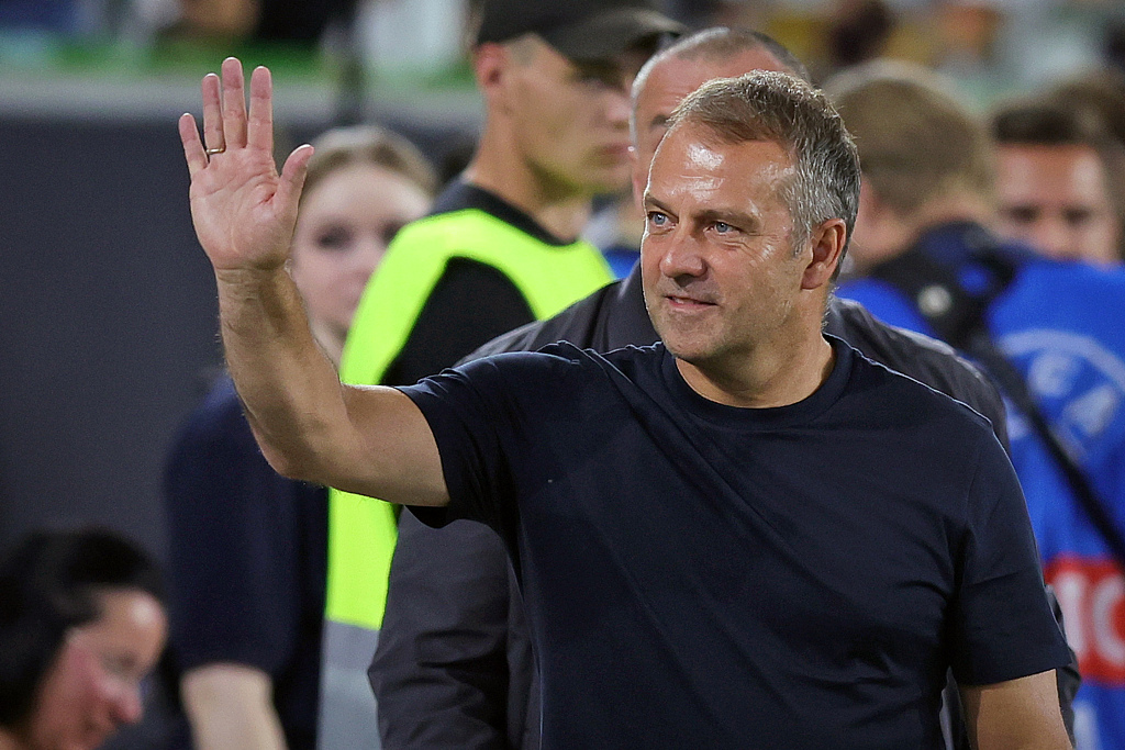 Hansi Flick, manager of Germany, greets spectators ahead of the friendly against Japan at Volkswagen Arena in Wolfsburg, Germany, September 09, 2023. /CFP