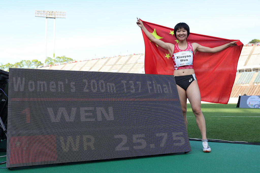 Wen Xiaoyan of China celebrates after setting a new world record in the women's 200m T37 final during the World Para Athletics Championships in Kobe, Japan, May 25, 2024. /CFP