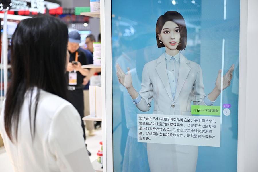 A virtual human based on artificial intelligence technology answers a question from a visitor at the fourth China International Consumer Products Expo (CICPE) in Haikou City, south China's Hainan Province, April 15, 2024. /Xinhua
