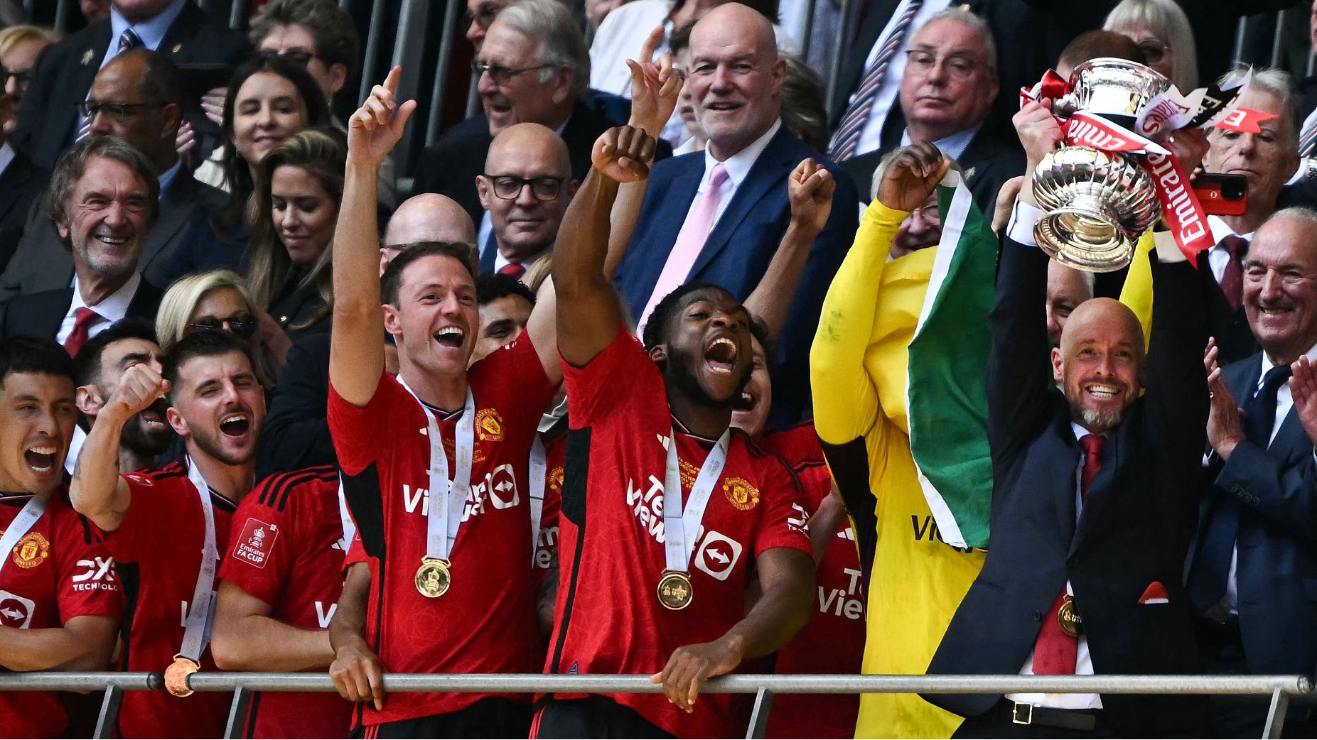 Manchester United's Dutch manager Erik ten Hag lifts the trophy to celebrate his team's victory in the FA Cup final at Wembley stadium, in London, England, May 25, 2024. /CFP