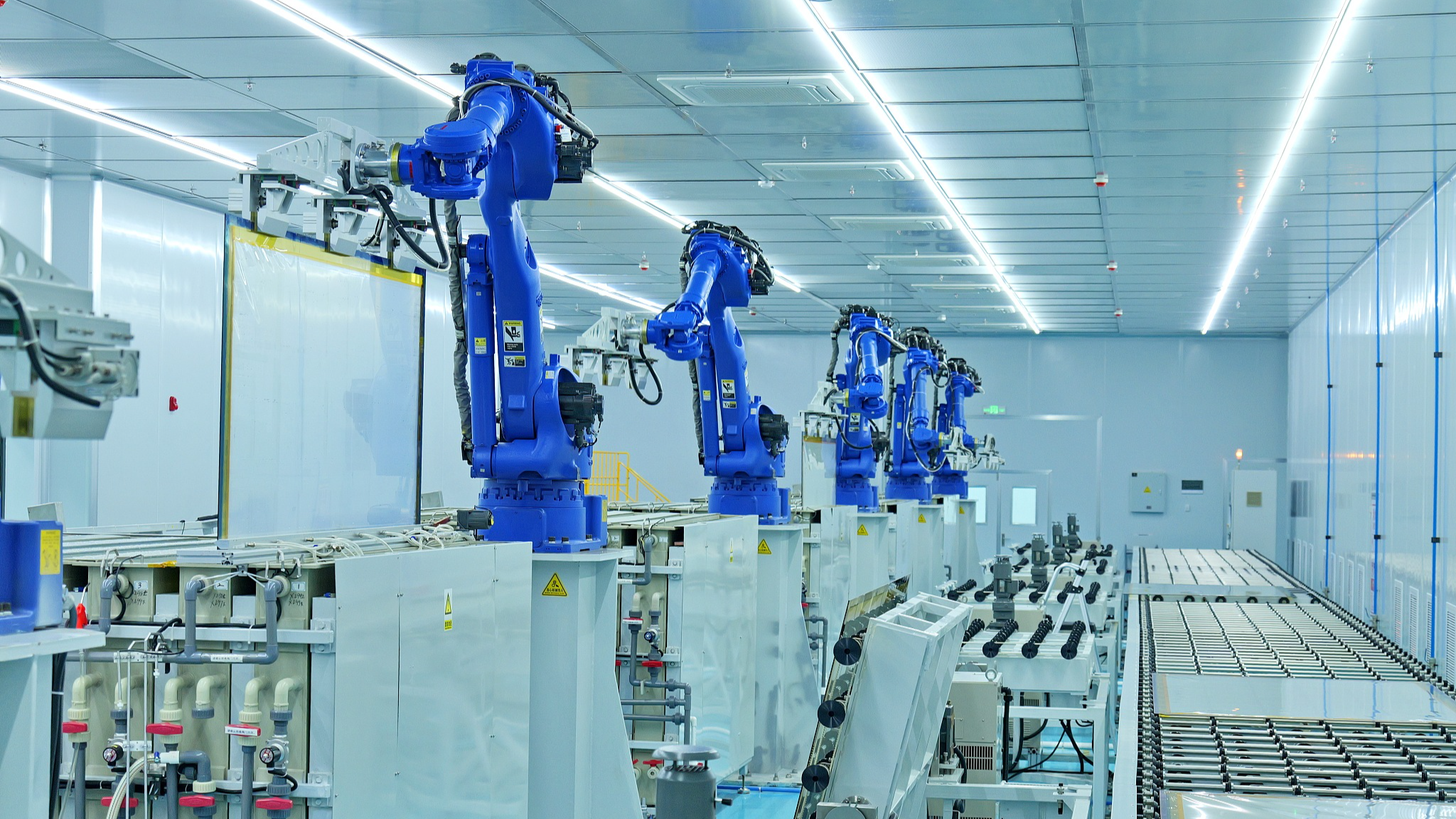 Intelligent robots process transparent conducting films using mechanical arms in Ganzhou City, east China's Jiangxi Province, May 22, 2024. /CFP