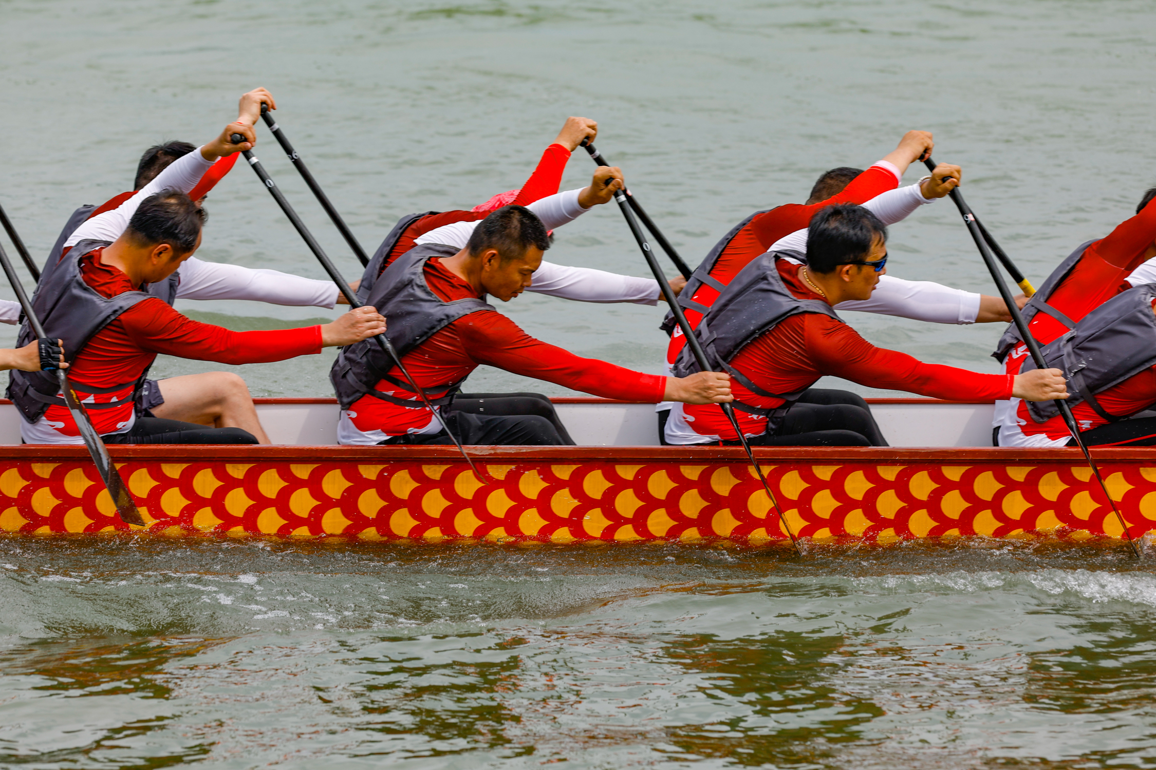 Participants paddle during a dragon boat race at Dugonghu National Wetland Park in Wuhan, Hubei Province on May 26, 2024. /IC