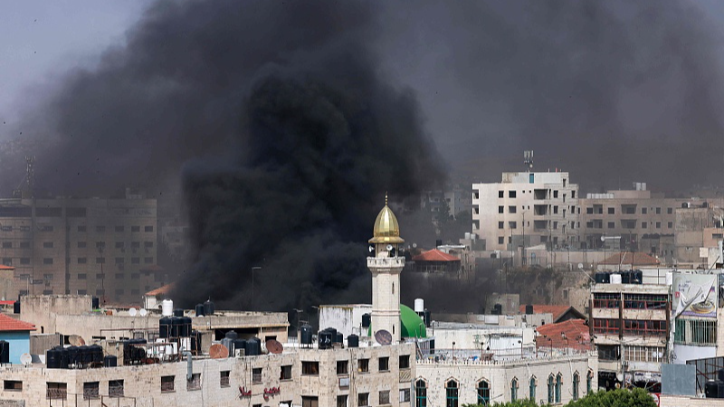 Smoke billows during a raid by Israeli forces in the Palestinian refugee camp of Jenin in the occupied West Bank, May 21, 2024. /CFP