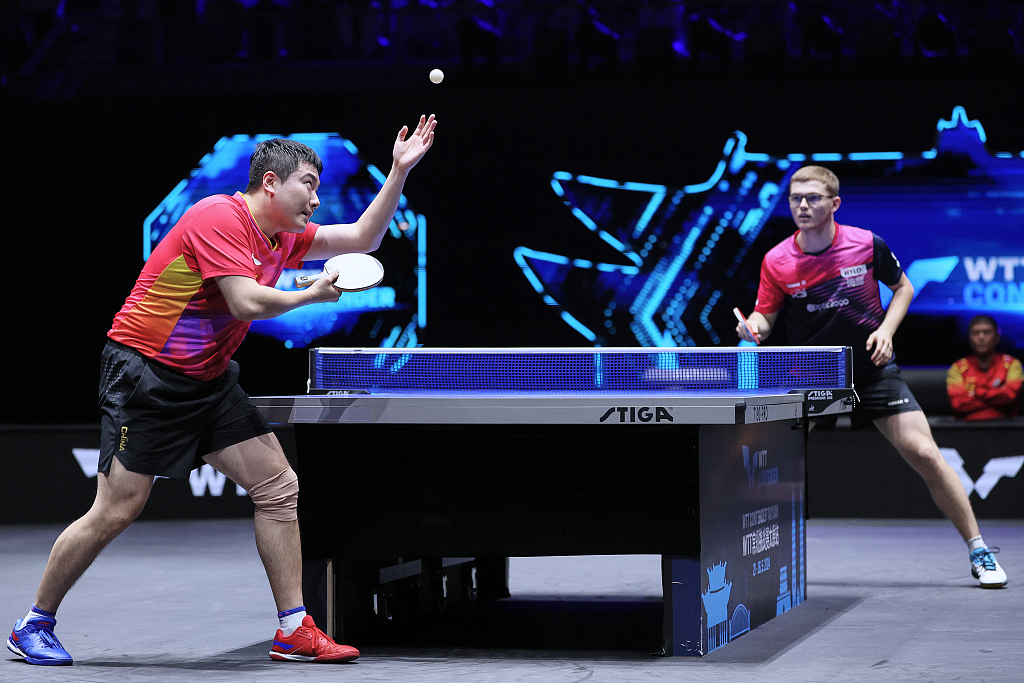 China's Liang Jingkun (L) serves to France's Alexis Lebrun in their men's singles final at the WTT Contender event in Taiyuan, China, May 26, 2024. /CFP