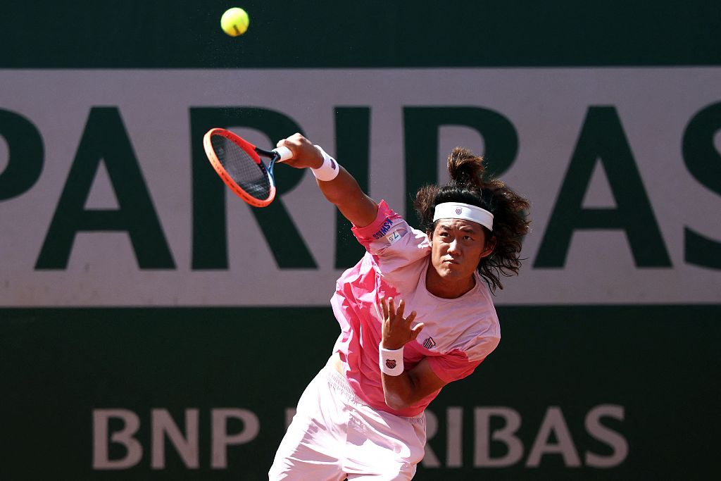 China's Zhang Zhizhen serves to Australia's Aleksandar Vukic (not pictured) during their men's singles match at French Open tennis tournament in Paris, France, May 26, 2024. /CFP