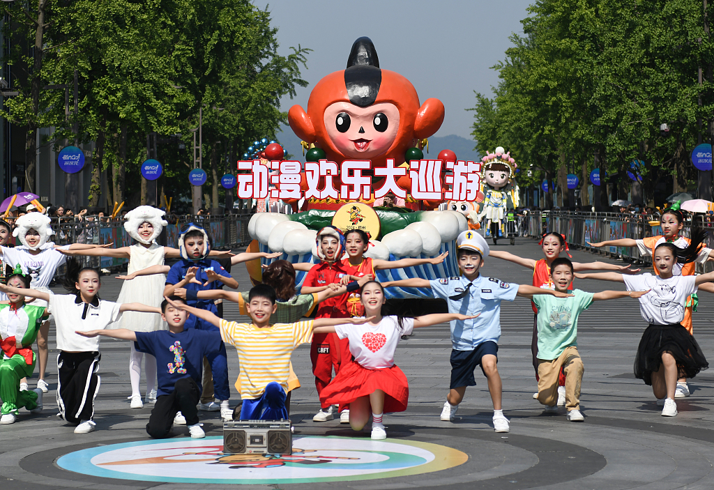 A parade is held on a lakeside pedestrian street in Hangzhou on May 18, 2024 as a prelude to the 20th China International Cartoon and Animation Festival (CICAF). /CFP