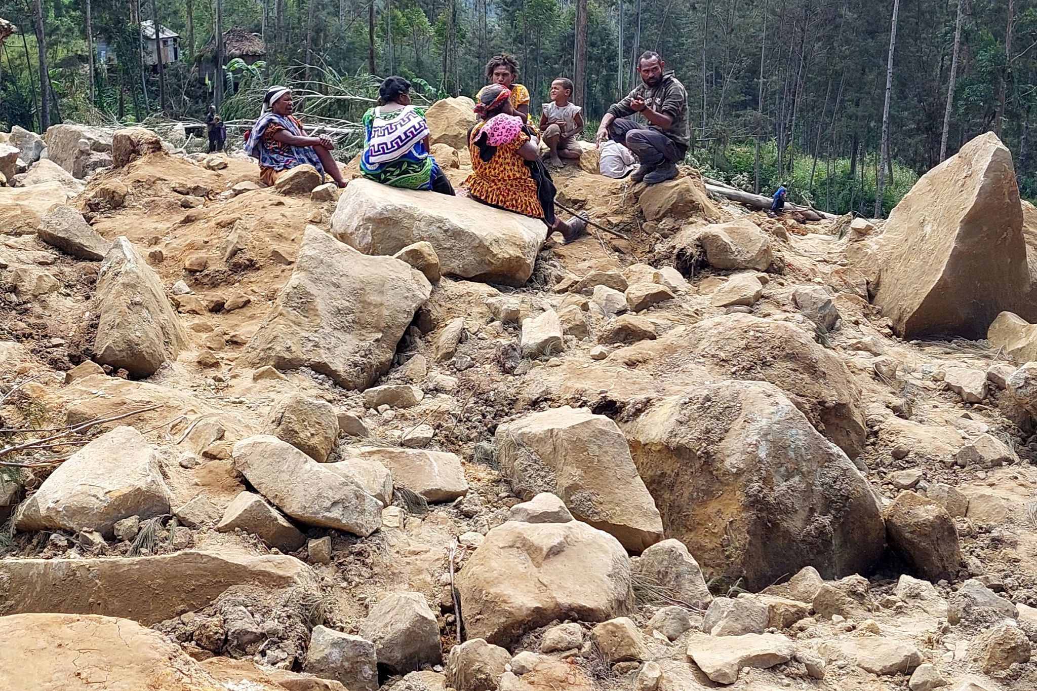 Family members of missing villagers are seen at the site of a landslide in Mulitaka village in the region of Maip Mulitaka, Papua New Guinea's Enga Province, May 26, 2024. /CFP