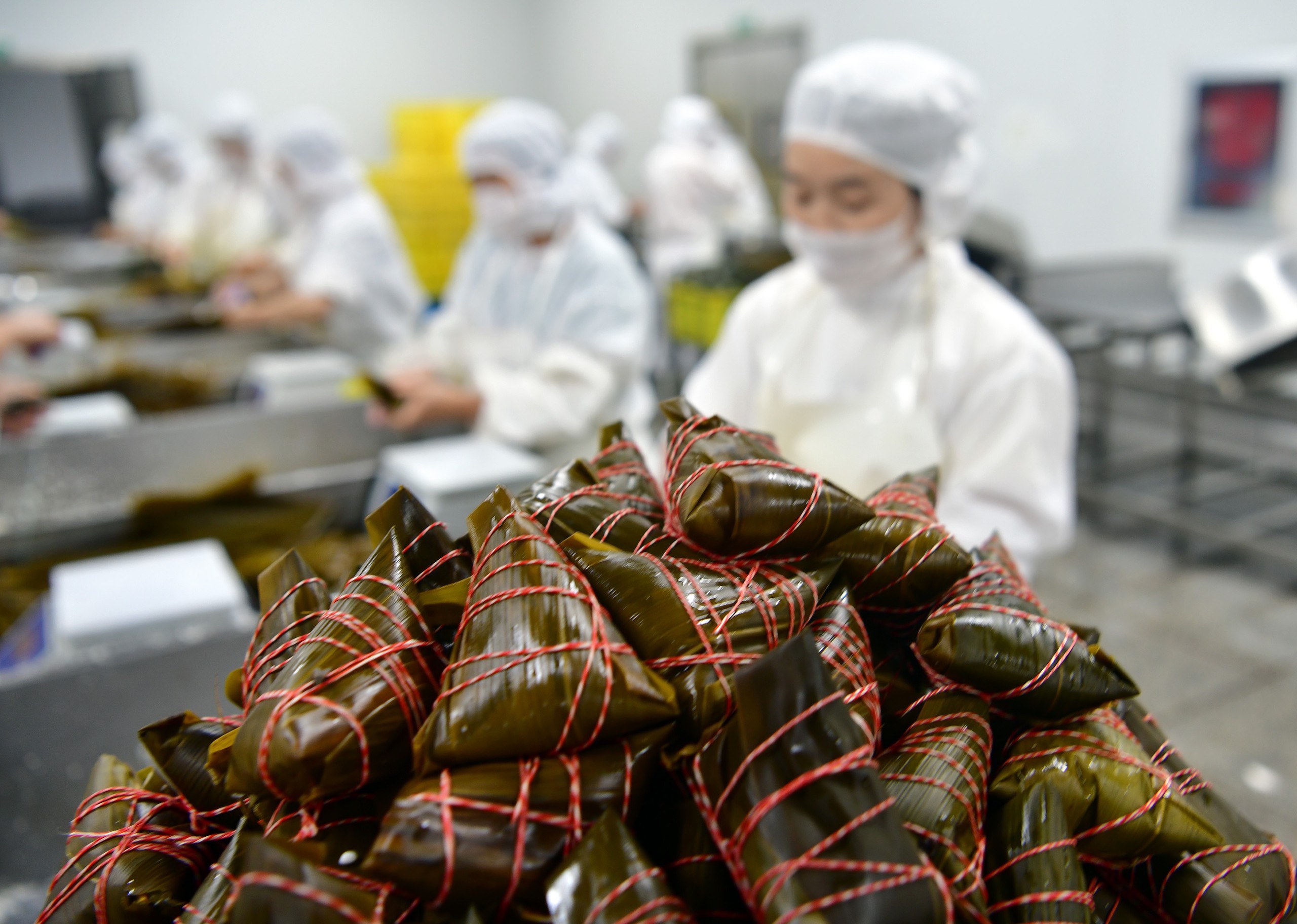 Freshly produced zongzi are pictured at a factory in Zigui County, Hubei Province on May 26, 2024. /IC