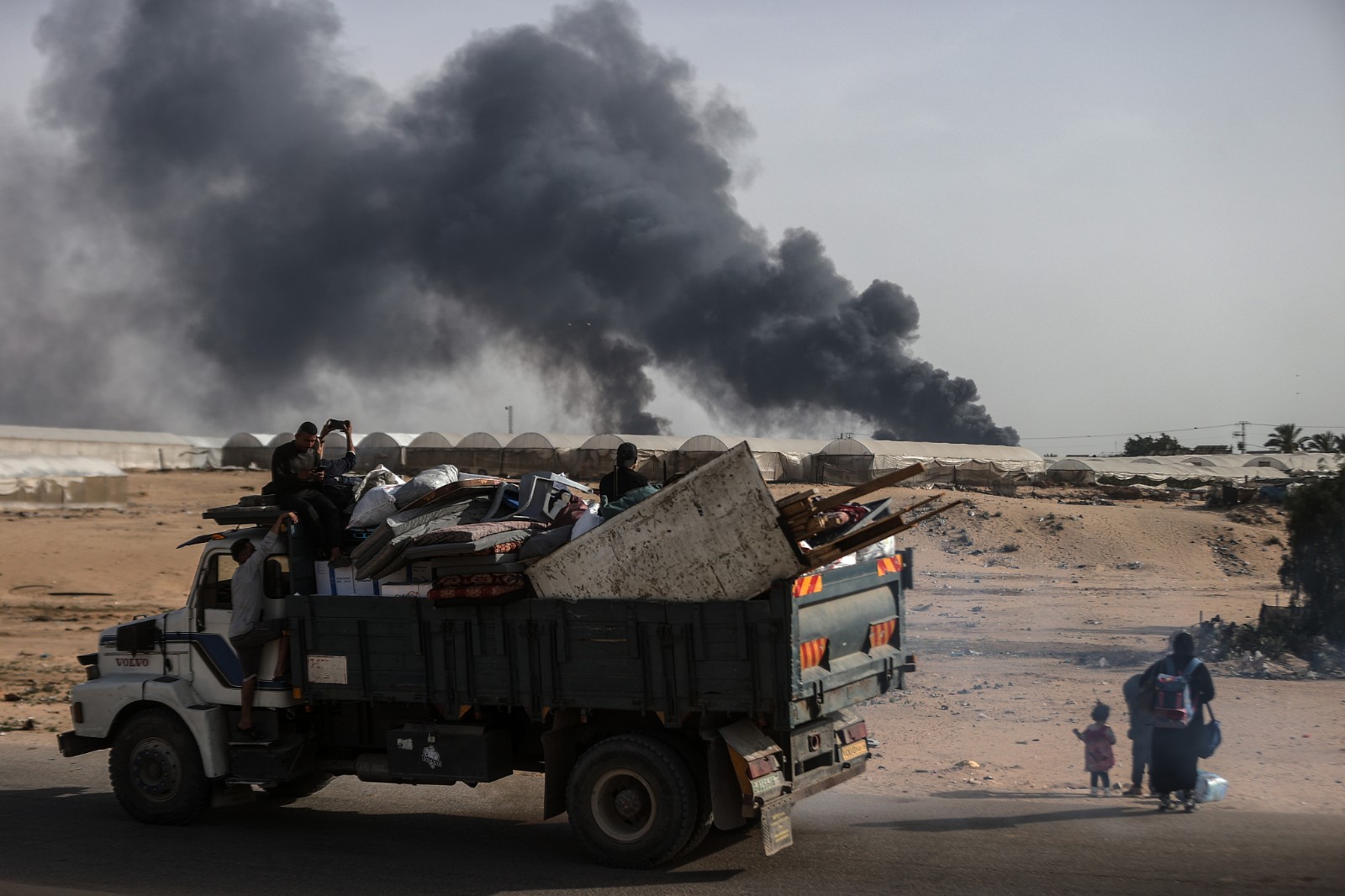 Palestinians flee after the Israeli army targeted tents in Al-Mawasi, previously declared a 