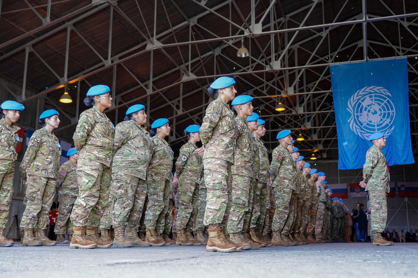 Members of the UN Peacekeeping Force in Cyprus (UNFICYP) take part in a ceremony marking the 60th anniversary of their presence on the eastern Mediterranean island, in the buffer zone separating the divided Cypriot capital Nicosia, March 4, 2024. /CFP