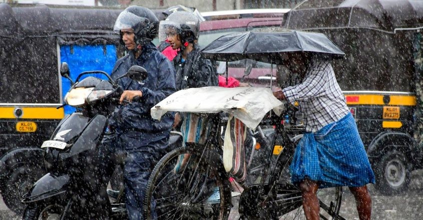 People on a road on the first day of monsoon rains in Thiruvananthapuram, Kerala, India, May 29, 2024. /Reuters