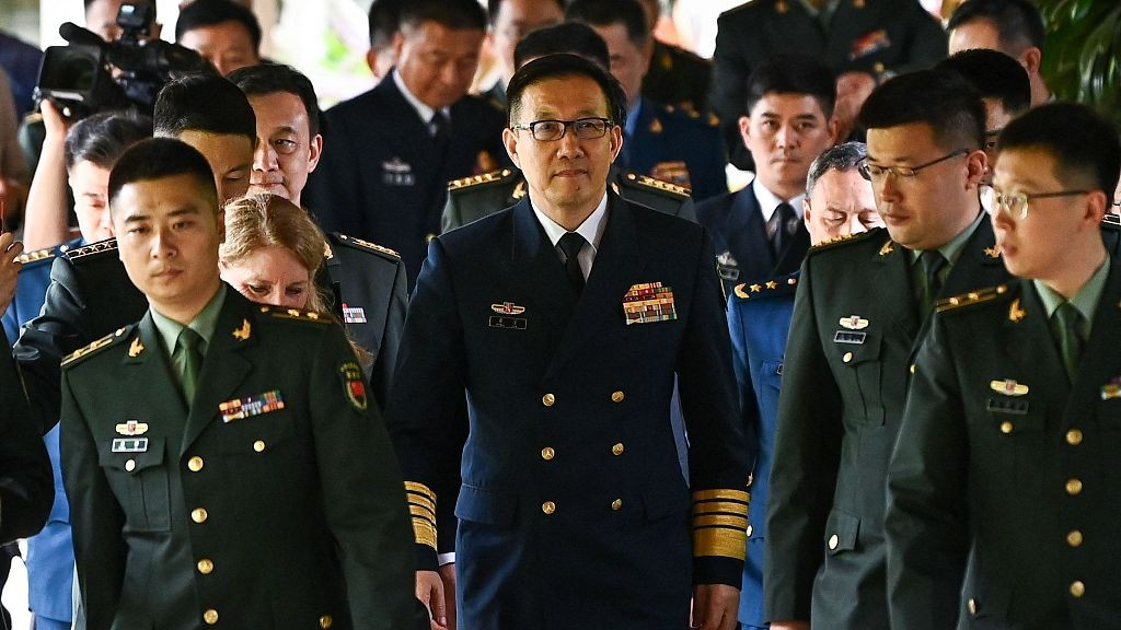 Chinese Defense Minister Dong Jun (C) walks out after a bilateral meeting with U.S. Secretary of Defense Lloyd Austin on the sidelines of the 21st Shangri-La Dialogue at the Shangri-La Hotel in Singapore, May 31, 2024. /CFP