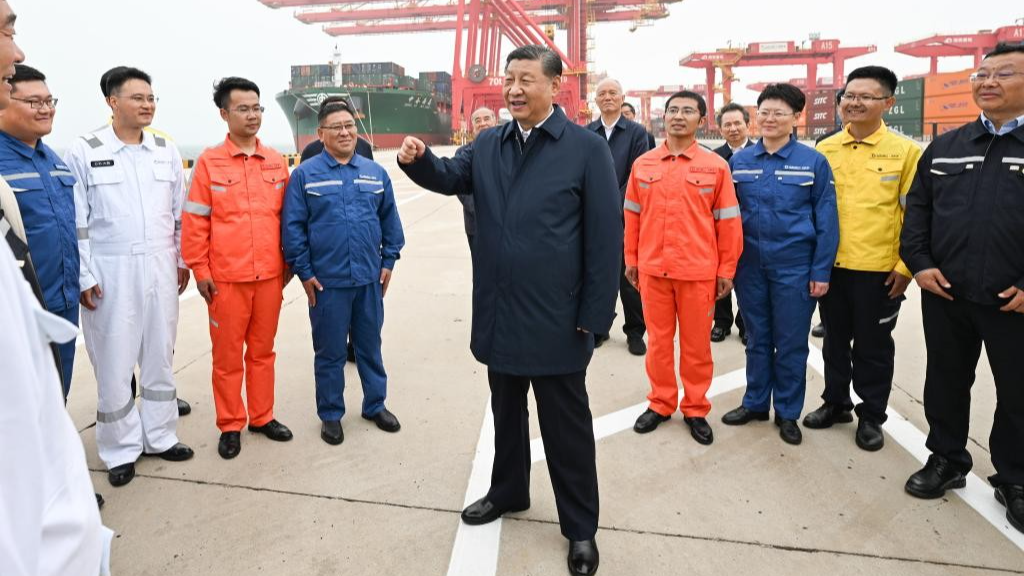 Chinese President Xi Jinping, also general secretary of the Communist Party of China Central Committee and chairman of the Central Military Commission, visits Rizhao Port to learn about progress in promoting the smart and green development of the port and expanding the opening up, in Rizhao City, east China's Shandong Province, May 22, 2024. /Xinhua
